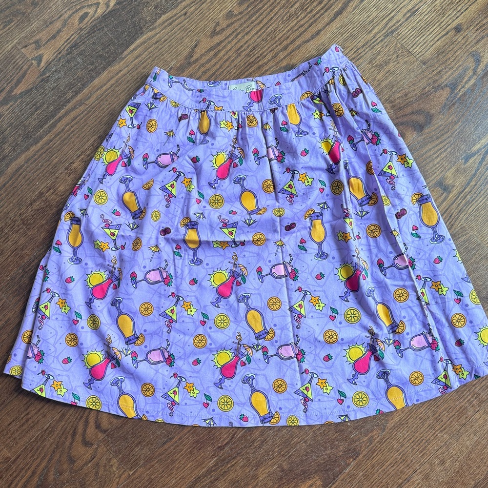 LINDY BOP ‘PRYIA' MID-CENTURY INSPIRED SWING SKIRT IN PINK SUMMER COCKTAIL PRINT